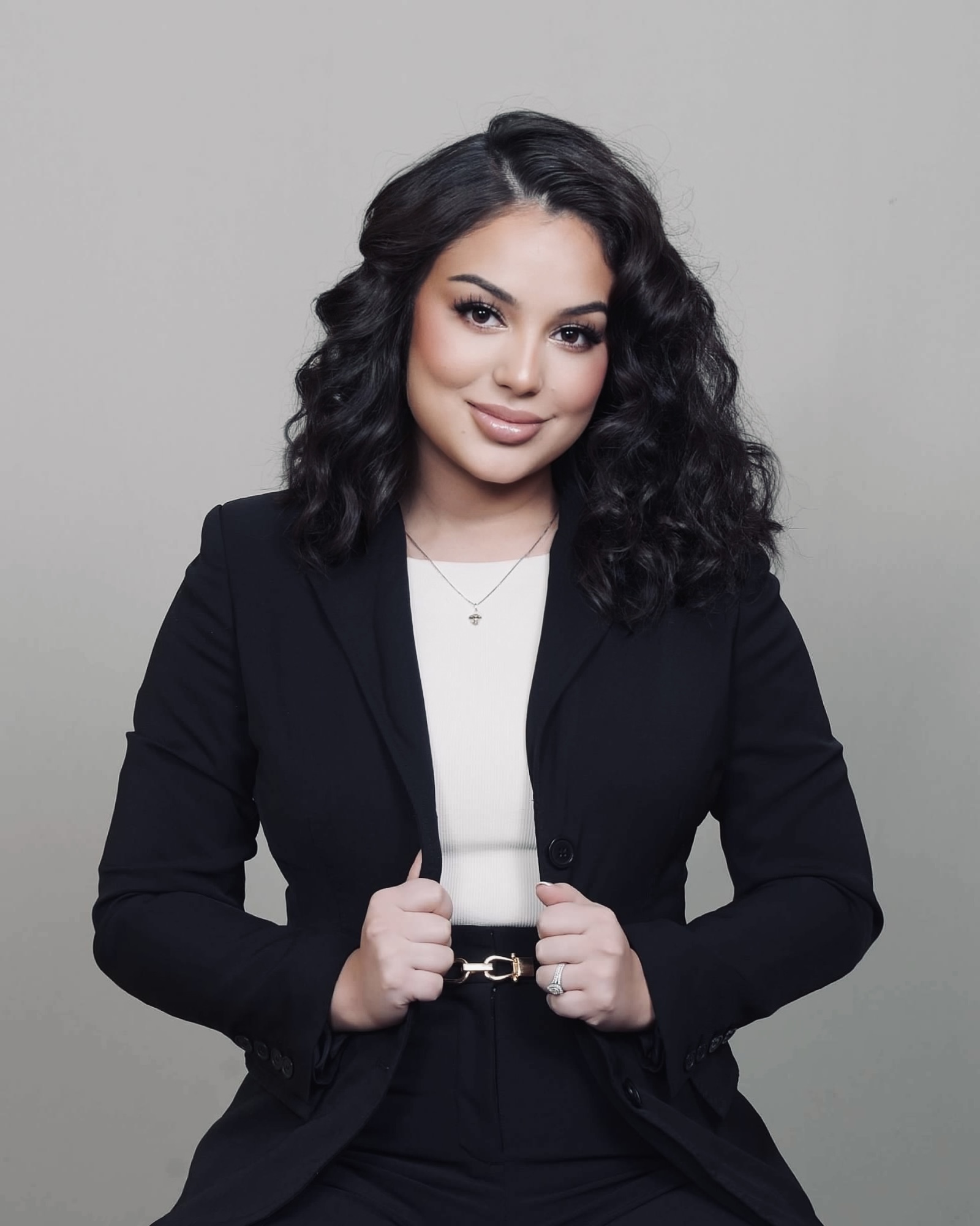 Gisselle Martinez seated in professional branding portrait